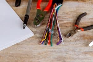 Insulation strippers set of electric wires nippers on blue background electricity concept. Insulation strippers electric wire cutter pliers