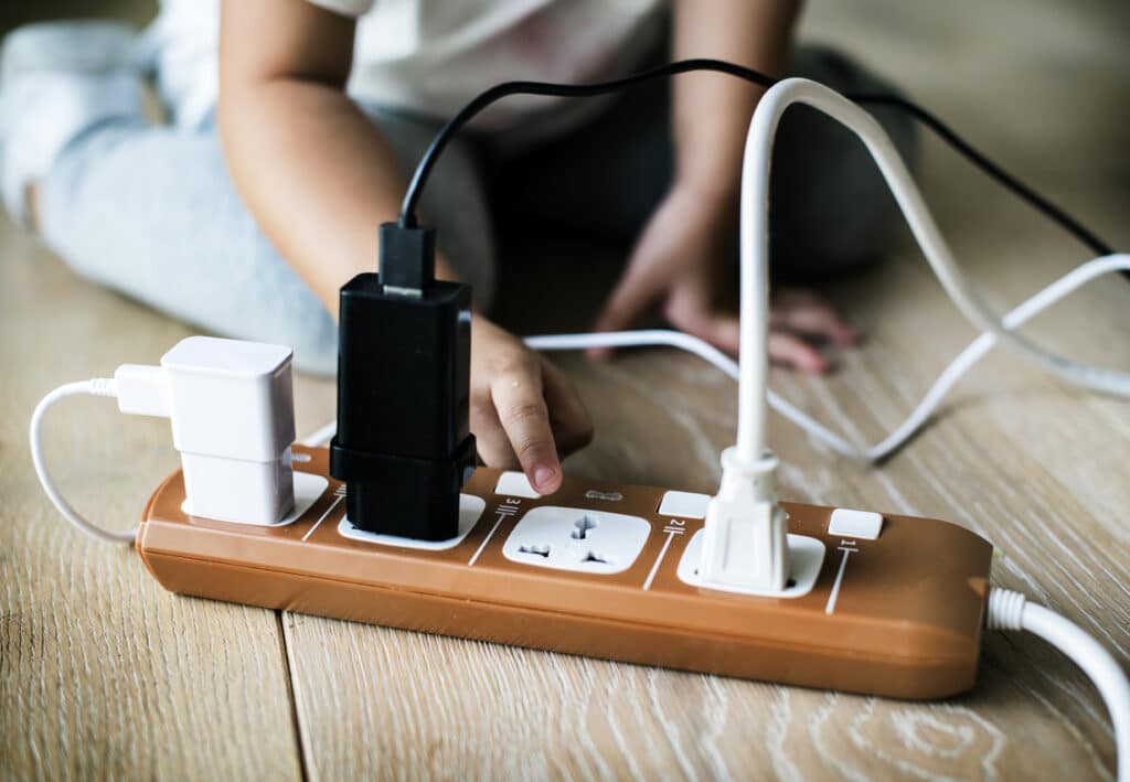 Toddler playing with plug