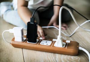 Toddler playing with plug