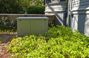 Residential standby generator installed on a concrete pad